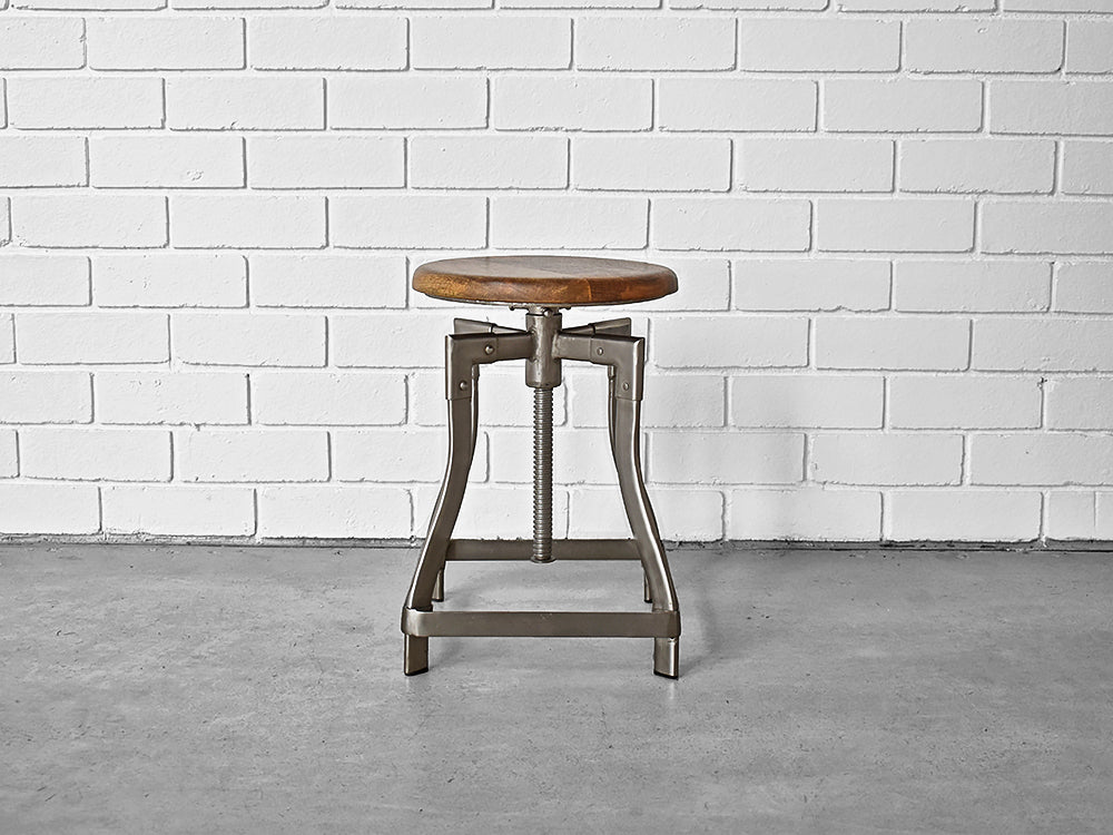 industrial stool with metal frame and wooden seat