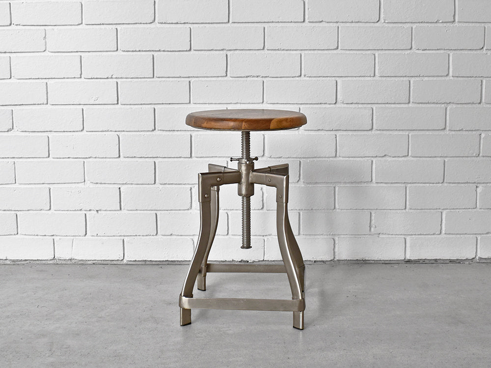 industrial bar stool from a distance with adjustable seat