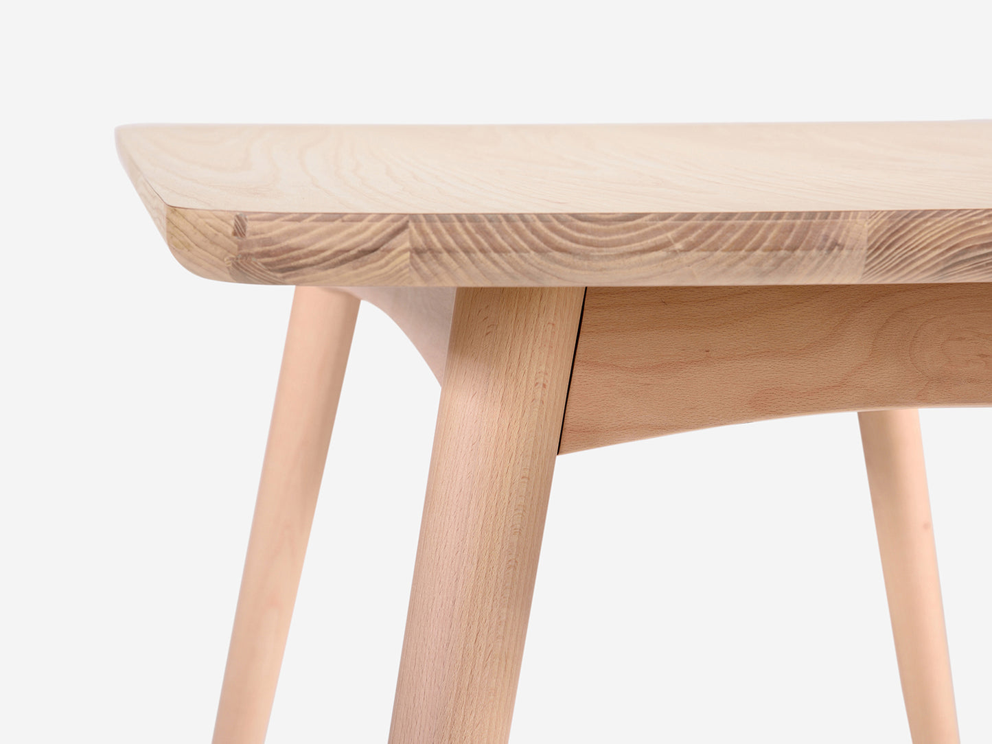 Close up side on photo showing the side of the Table Top and the Beech Wood legs