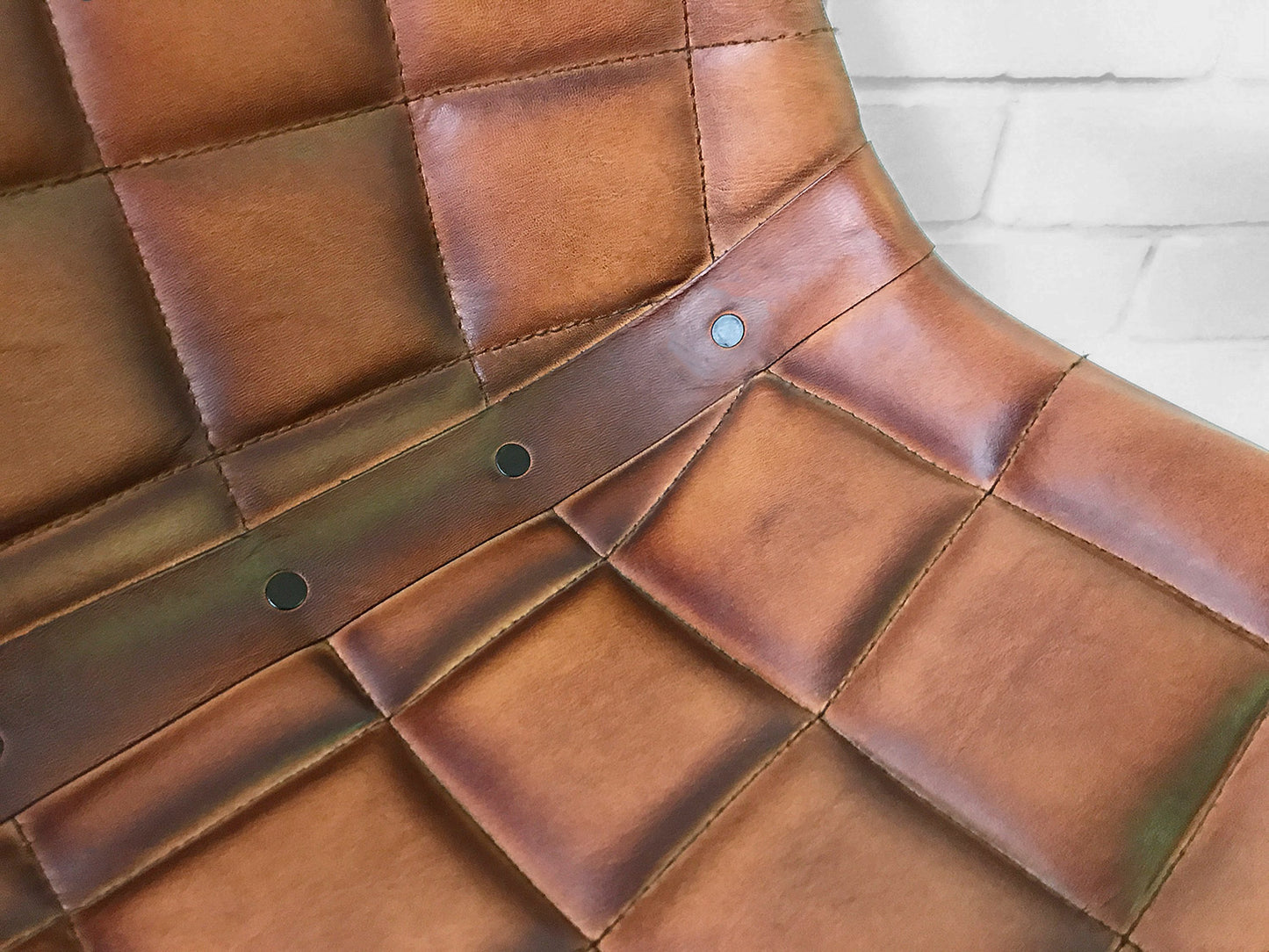 Close up of Brown Leather Padded Seat showing detail and padding
