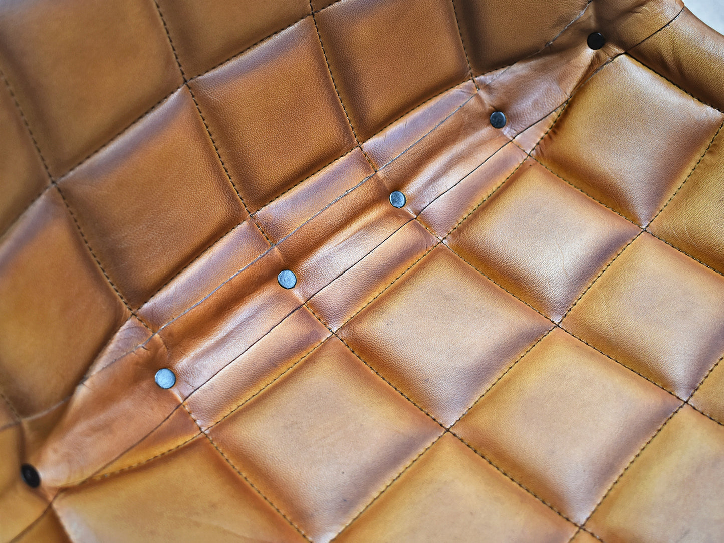 Close up of Brown Leather Padded Seat showing detail and padding