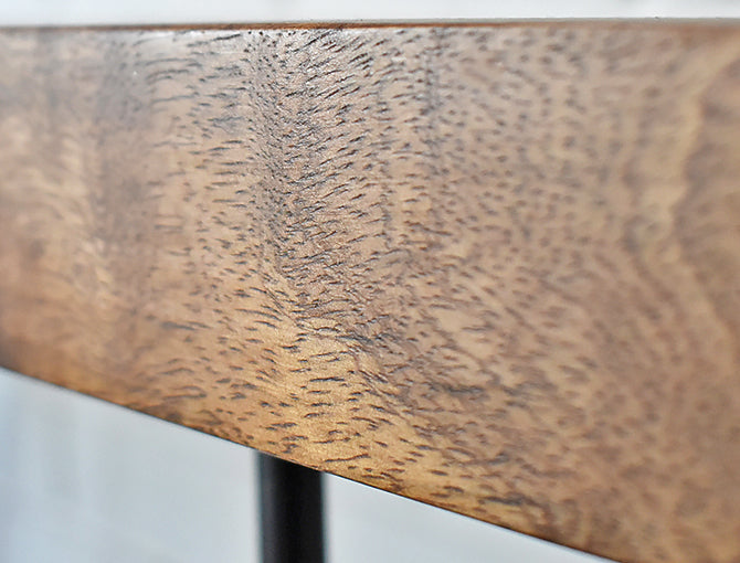 Close up showing mango wood detail graining on the table top
