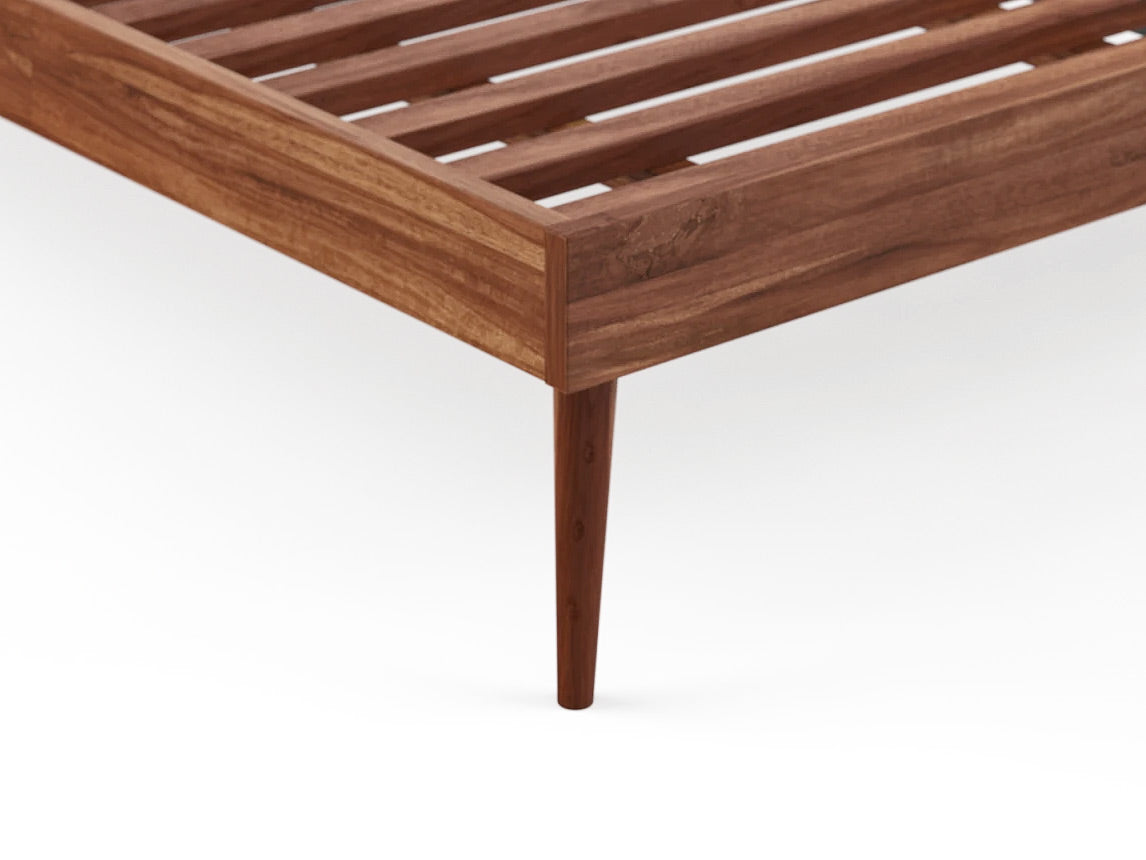 Close up of bed wooden frame leg