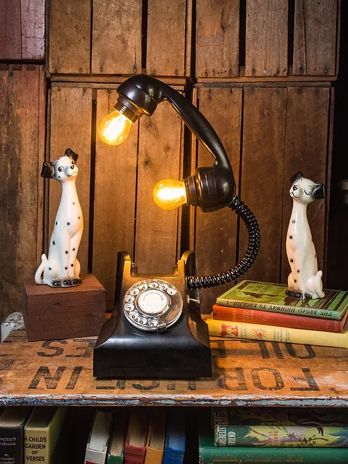 Black Upcycled Vintage Telephone Lamp with book decorations around it