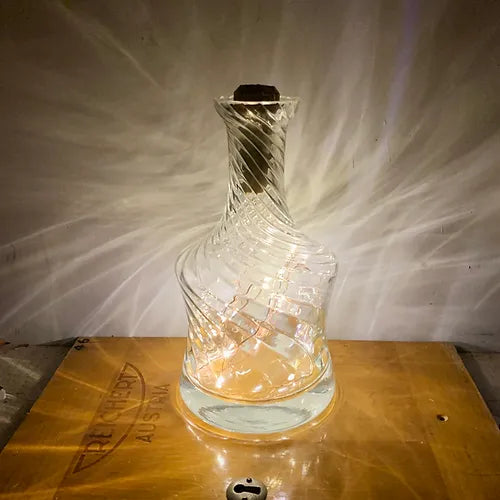 Cork lights in a whiskey jar illuminated