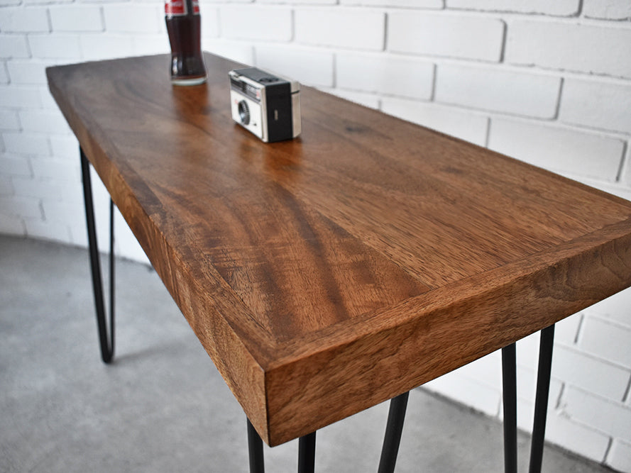 retro hairpin leg console close up showing mango wood table top and grain
