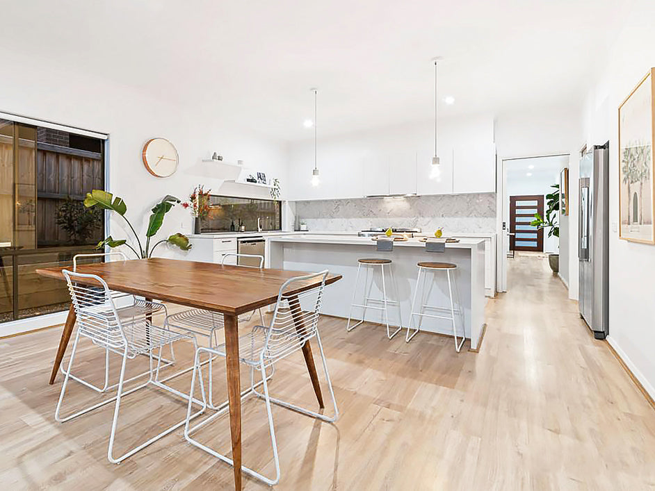 Scandinavian Dining Table in a white kitchen with white chairs