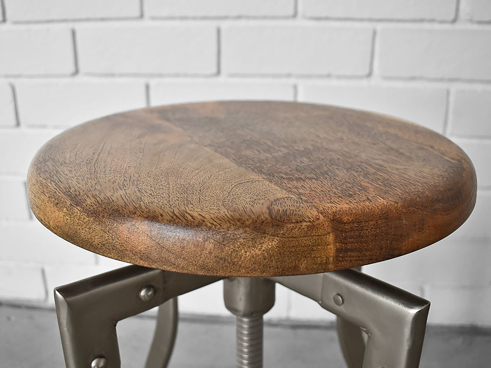 closeup of vintage stool detail showing mango wood seat 