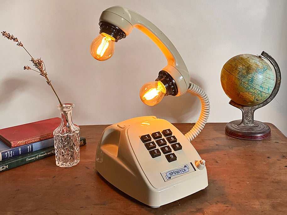 white vintage retro telephone lamp with two small bulbs